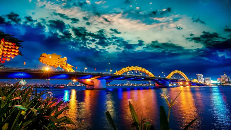da,nang,,vietnam:,dragon,bridge,at,sunset,which,is,considered