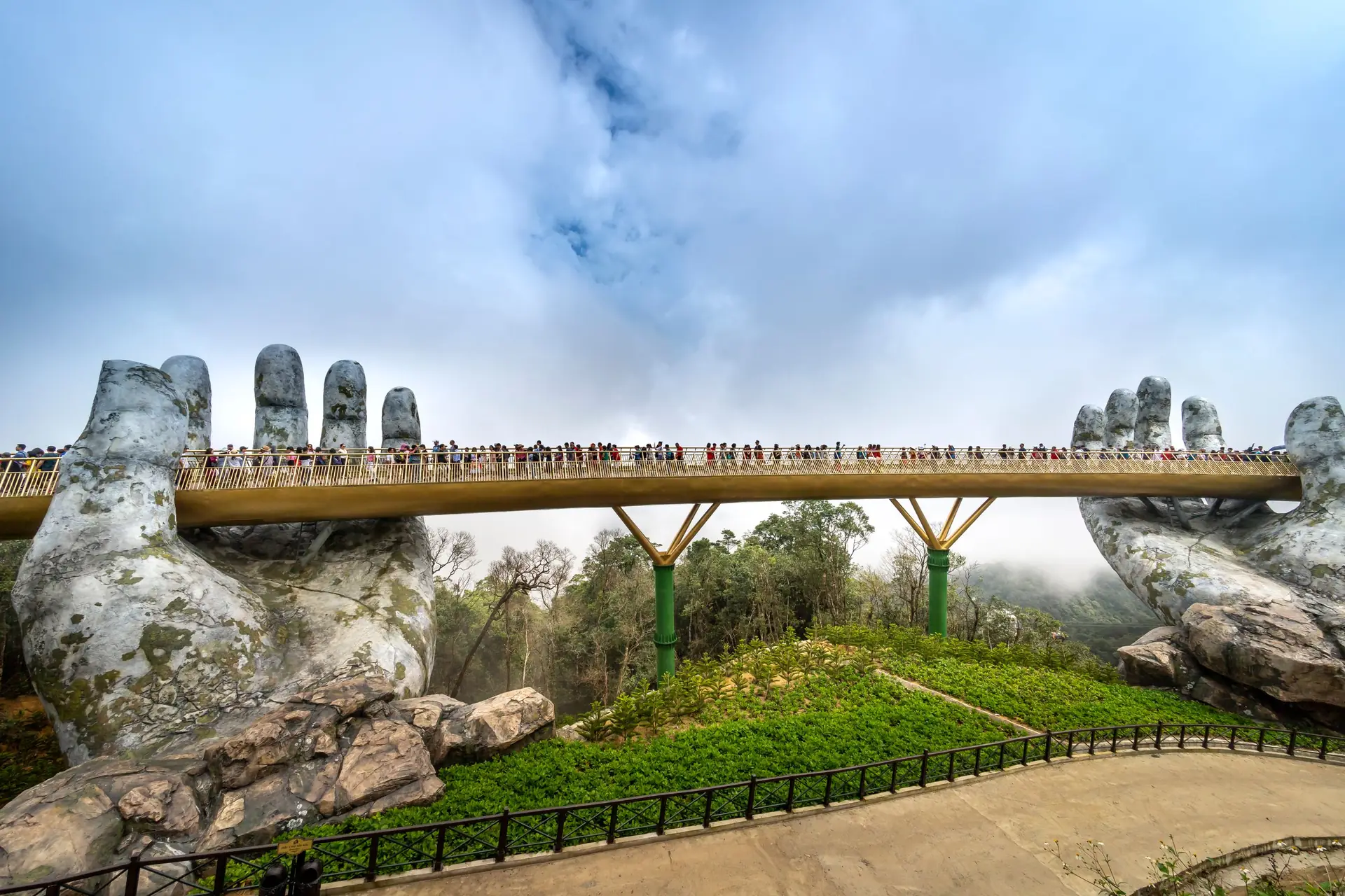 Golden Bridge in Da Nang held by giant stone hands, a popular tourist attraction.